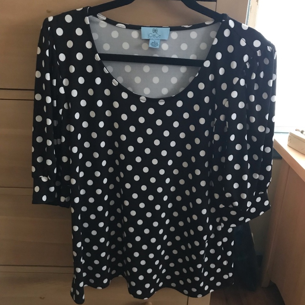 Black and white polka dot top.